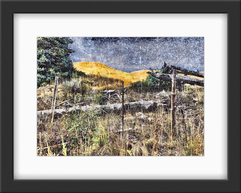 Worn Fence Under Dark Skies Light on Background Mountain image 1