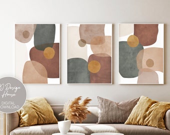 May include: Three abstract art prints with geometric shapes in shades of brown, beige, and green. The prints are hung on a white wall above a gray couch with pillows.