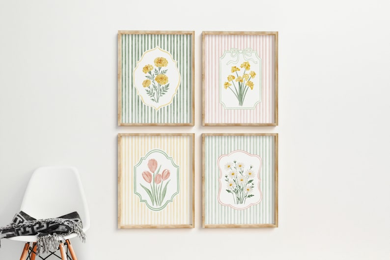 May include: Four framed floral art prints. Each print features a different flower illustration in a decorative frame against a striped background. The frames are light brown, and the backgrounds are pastel colors: green, pink, and yellow.