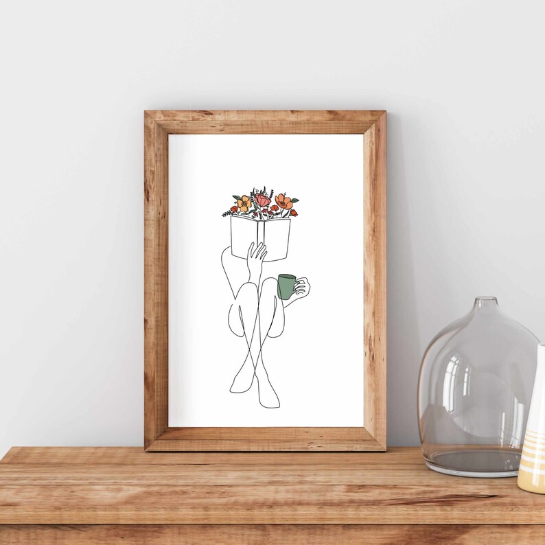 May include: A line drawing of a person sitting with a book over their head and a cup of coffee in their hand. The book is decorated with colorful flowers.