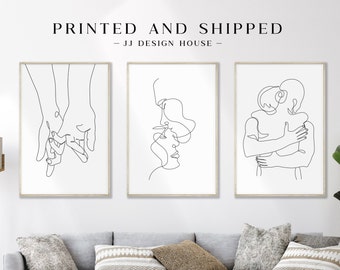 May include: Three framed minimalist art prints. The prints feature line drawings of hands holding, faces kissing, and figures embracing. The text "PRINTED AND SHIPPED - JJ DESIGN HOUSE -" is at the top of the image.