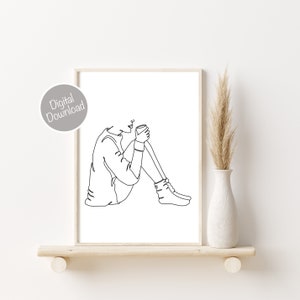 Puede incluir: Dibujo de l&iacute;nea de una persona sentada con una taza de caf&eacute; o t&eacute;. La persona lleva un su&eacute;ter y calcetines. El dibujo est&aacute; en blanco y negro.