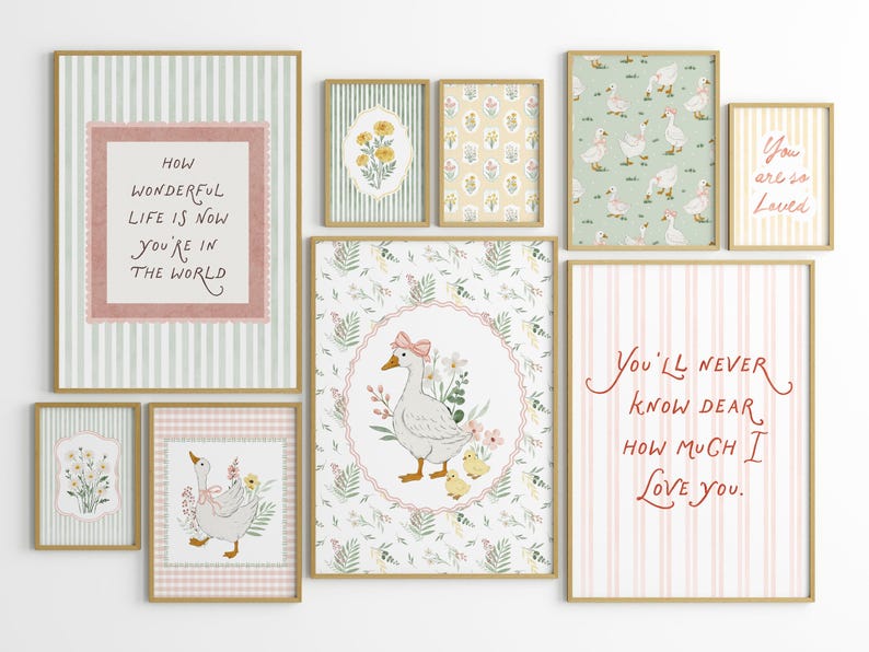 May include: A collection of framed art prints with a whimsical, pastoral theme. The prints feature illustrations of geese, floral patterns, and inspirational quotes in a soft color palette of pink, green, and yellow. The frames have a gold finish.