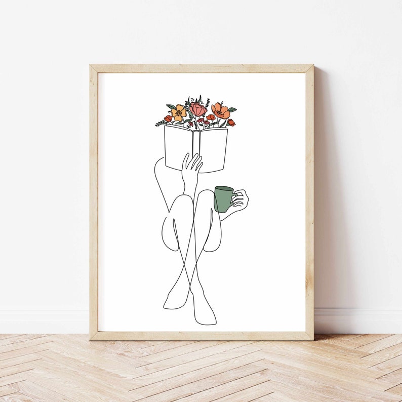 May include: Line art drawing of a person sitting with a book and a cup of coffee. The book is open and has flowers on top of it. The person is sitting with their legs crossed and holding the cup in their right hand.