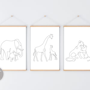 May include: Three black and white line art prints of animal families. The first print shows an elephant and a baby elephant. The second print shows a giraffe and a baby giraffe. The third print shows a lion and a baby lion.