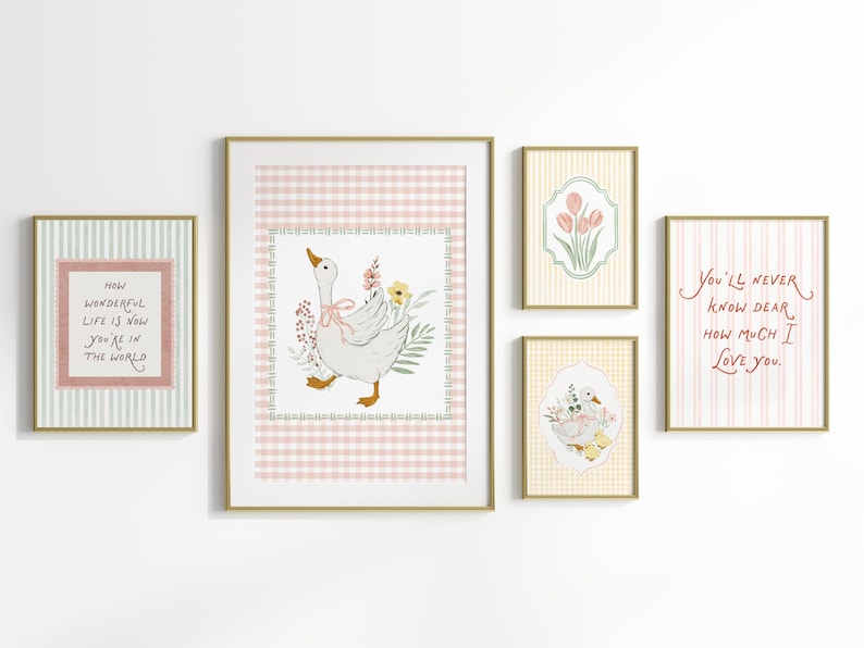 May include: A collection of framed art prints with gold frames. The prints feature illustrations of a goose with flowers, tulips, and text that reads "How wonderful life is now you're in the world" and "You'll never know dear how much I love you."