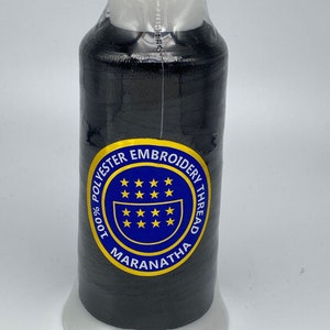 May include: A spool of black 100% polyester embroidery thread with a blue and yellow label that reads "100% Polyester Embroidery Thread Maranatha".