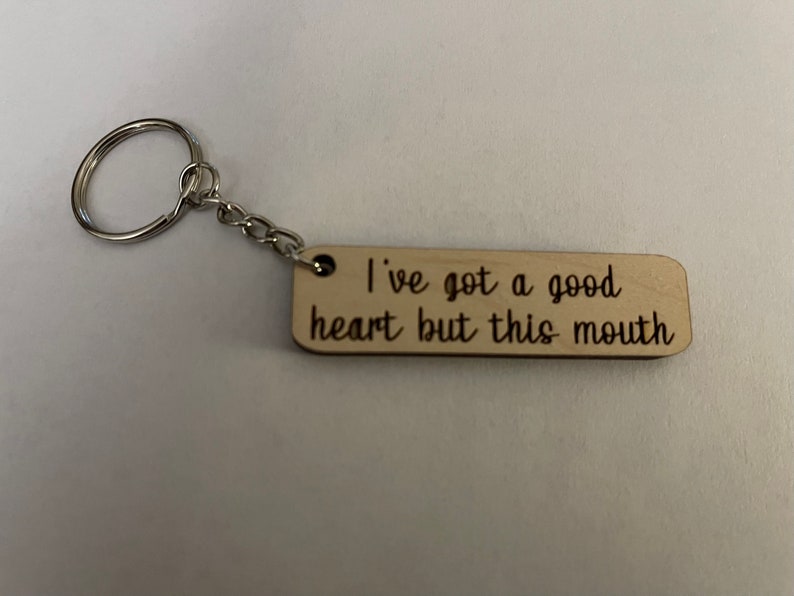 A keychain that says "I've got a good heart but this mouth".