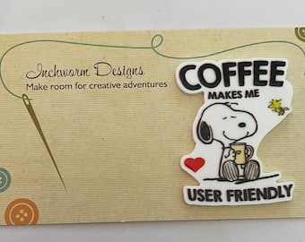 May include: White card with brown text that reads "Inchworm Designs Make room for creative adventures". A white sticker with a cartoon dog holding a cup of coffee and the text "COFFEE MAKES ME USER FRIENDLY" is on the card.