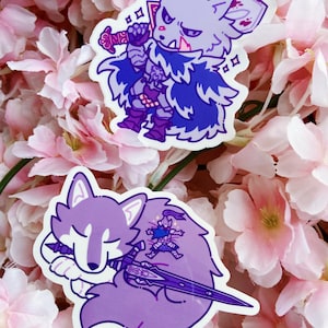 May include: Two stickers featuring cartoon wolf characters. One wolf is a warrior with a sword, wearing armor and a cape. The other wolf is sleeping, with a sword and a small figure on its back. The stickers are shades of purple and blue.