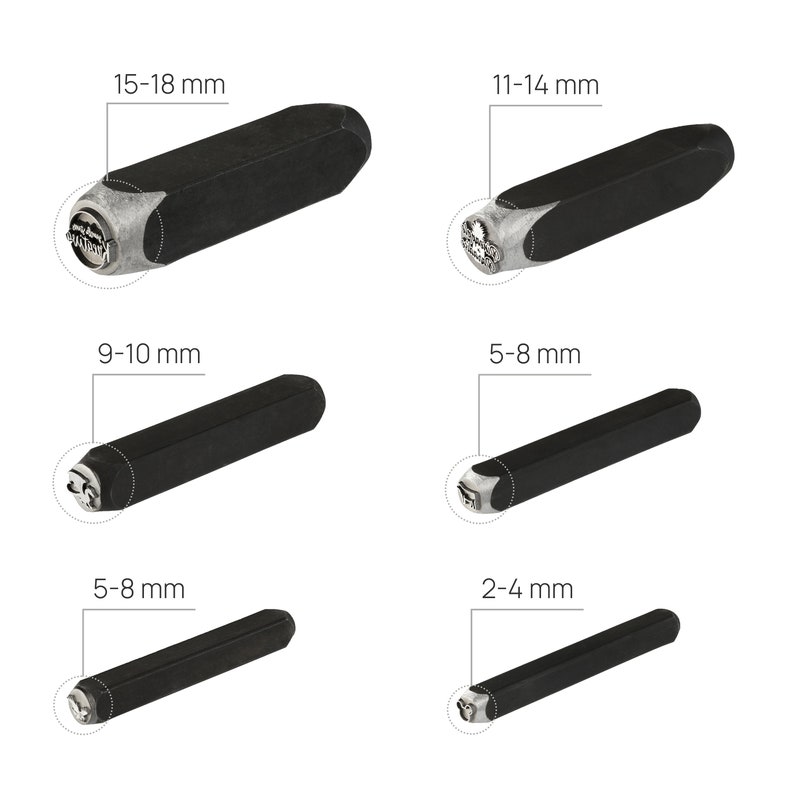 May include: Set of six black metal letter stamping tools with different sizes, ranging from 2-4 mm to 15-18 mm. Each tool has a silver metal head with a design.