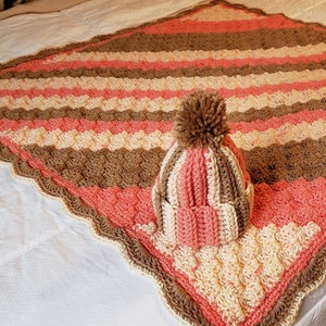 Crocheted newborn blanket and hat set in beautiful colors that would work for a boy or girl.