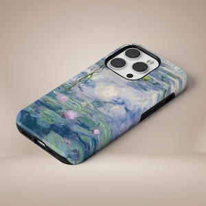 May include: A phone case featuring a painting of water lilies against a blue and green background. The case has a black border and a camera cutout.