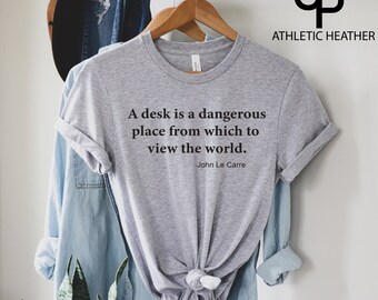 A desk is a dangerous place from which to view the world -John Le Carre Shirt, John Le Carre T-Shirt, Souvenir shirt for John le Carre