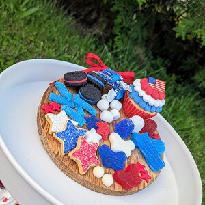 Fake 4th of July charcuterie board, fake Patriotic cupcakes, Patriotic decor, red white and blue fake bakes, 4th of July tiered tray decor