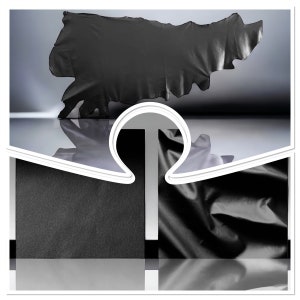 以下が含まれることがあります： 白い表面にかけられた黒い布が、ユニークな抽象的な形を作っています。布は質感があり、柔らかな素材でできているようです。
