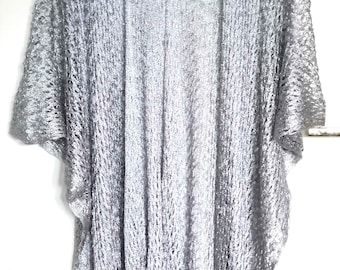 vintage 90s lattice-styled silver cardigan with fringed tail end.