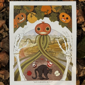 May include: A rectangular art print titled "WHAT A WONDERFUL HARVEST" featuring a central pumpkin-headed figure with long green ribbons, flanked by two large white skeletal hands, a black cat, and several apples against a rural landscape.