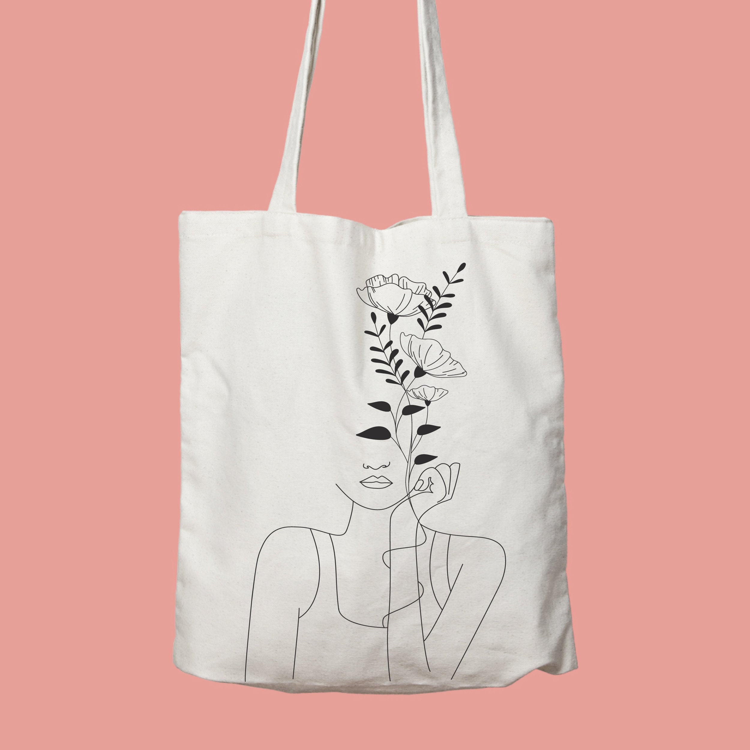 Women with flowers head one line art Tote Bag