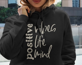 May include: A black hoodie with the text "positive vibes life mind" printed in white on the front.