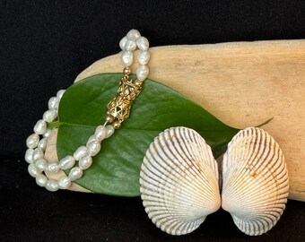 Vintage double stranded real freshwater pearl and  faux yellow gold clasp 7 inch bracelet.