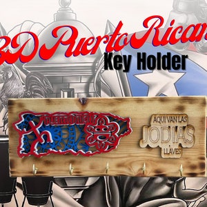 May include: A wooden key holder with a red, white, and blue cutout of the island of Puerto Rico. The key holder has five hooks and the text "Aqui van las Jodiás Llaves" is written on the right side.