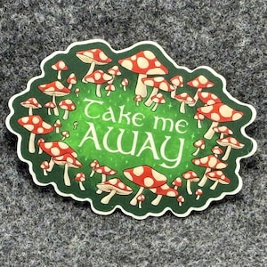 May include: A green and white sticker with a circle of red and white mushrooms and the text "Take me Away".