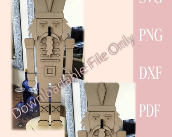 May include: A brown wooden nutcracker figurine with a tall hat, a moustache, and a beard. The nutcracker is standing on a round base.