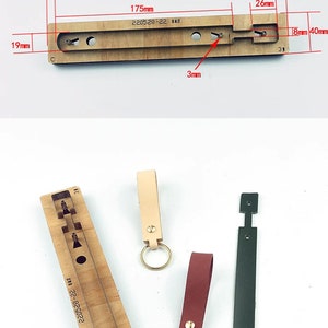 May include: A wooden leather craft template with a rectangular cutout and several smaller holes. The template is labeled "220528-22 日本刀" and has measurements in millimeters.  There are three leather keychains in the image: one is beige, one is red, and one is green.