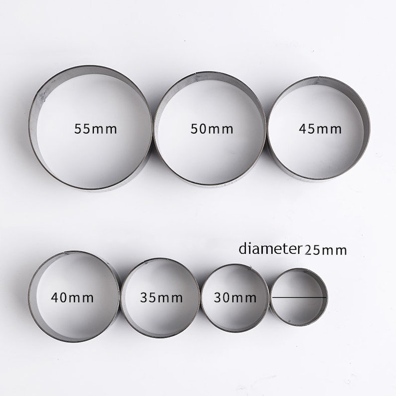 May include: Set of 7 round metal cookie cutters in various sizes: 55mm, 50mm, 45mm, 40mm, 35mm, 30mm, and 25mm diameter.