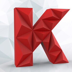 May include: A vibrant red, geometric letter "K" stands out against a white and gray polygonal background. The letter is 3D, with a faceted design, creating a modern and eye-catching visual. The overall aesthetic is clean and contemporary.