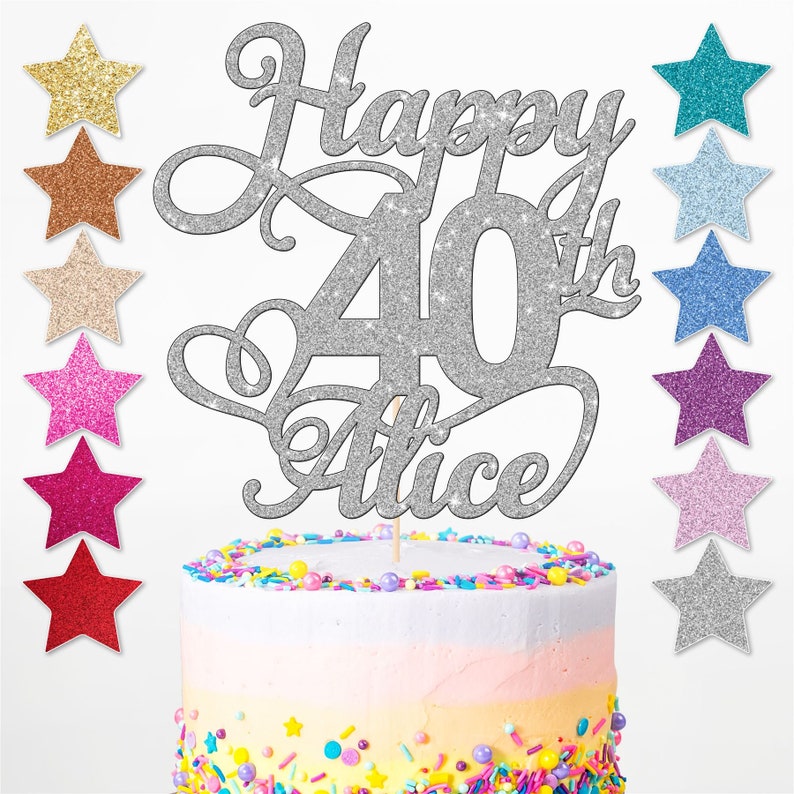 May include: Silver glitter cake topper with the text "Happy 40th Alice". The topper is on a cake with colourful sprinkles.