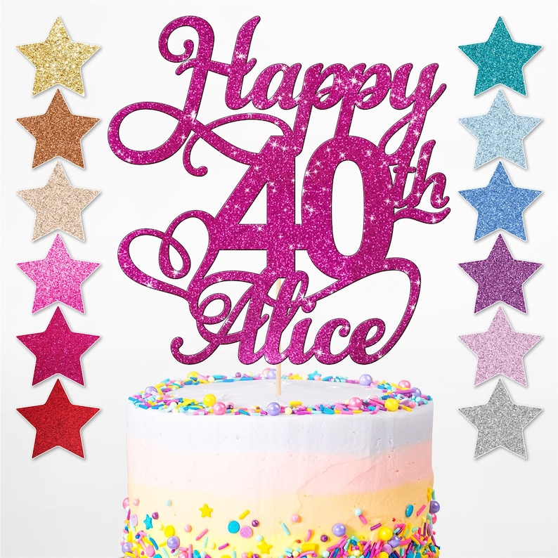 May include: Pink glitter cake topper featuring the text "Happy 40th Alice". The topper is shaped like a heart with a large number 40 in the centre. The topper is on a cake with colourful sprinkles.