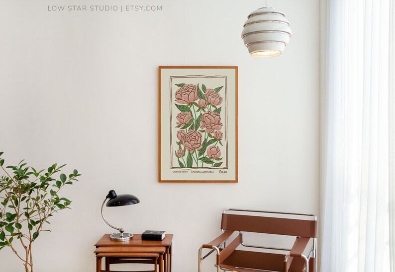 May include: A framed botanical illustration of pink peonies with green leaves and stems. The print is titled "Common Peony" and has the scientific name "Paeonia officinalis" and the number "Plate 101".