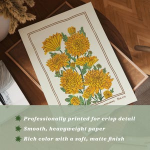 May include: A rectangular art print on off-white paper featuring a botanical illustration of yellow chrysanthemum flowers with green leaves, enclosed in a thin brown rectangular border, with the text Fig.016 printed in the bottom right corner.