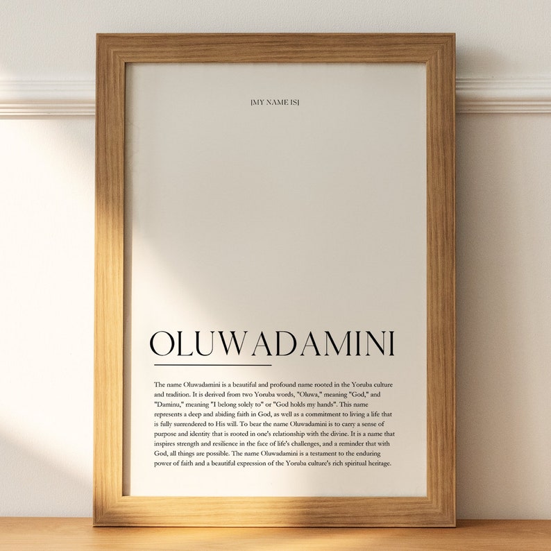 May include: A printable art print with a white background and black text. The text reads "(MY NAME ISI) OLUWADAMINI" and explains the meaning of the name Olawadamini, which is rooted in the Yoruba culture and tradition.
