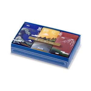May include: A set of four Japanese-themed erasers in a clear plastic box with a blue base. The erasers feature images of Mount Fuji, a wave, and a red and green landscape. The box has the text "富士山 消しゴム" (Mount Fuji eraser) and "PLUS" printed on it.