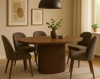 May include: A contemporary dining set with a circular wooden table and a ribbed base, accompanied by six upholstered chairs. A dark pendant light hangs above. Decorative framed art and a vase with greenery complete the room.