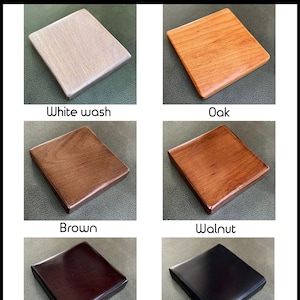 May include: Five wood samples in different colours: white wash, oak, brown, walnut, and mahogany. The samples are arranged in a grid pattern on a grey background. The text "you furnitures" is at the top of the image.