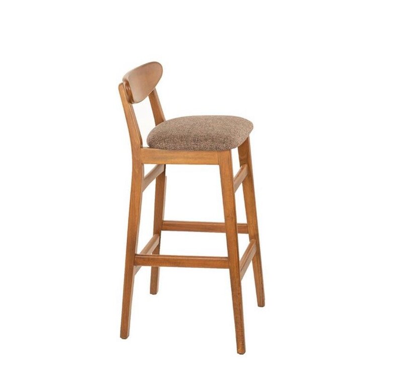 May include: A wooden bar stool with a brown upholstered seat and a curved back.