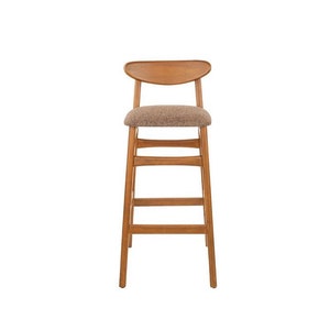 May include: A wooden bar stool with a brown fabric seat and a curved back.