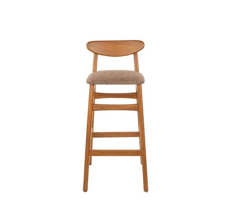 May include: A wooden bar stool with a brown fabric seat and a curved back.