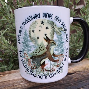 Rear perspective of the ceramic mug showcasing the continuation of the moonlit forest design, highlighting the intricate details of the pine trees and nocturnal ambiance. The seamless wrap-around artwork makes it a unique piece for witchcraft and celestial enthusiasts.