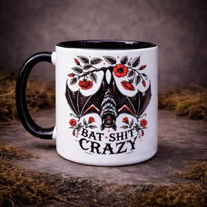 Dark humour bat mug with gothic bat artwork and bat shit crazy slogan alternative gift