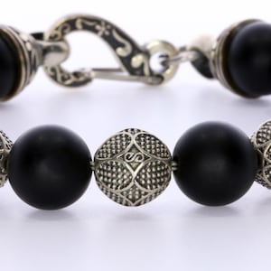 Matte Black Onyx Bead Bracelet On Steel Cable With Custom Silver Clasp and Custom Silver Beads 10mm - AAA Quality