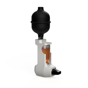 May include: A white and gray perfume atomizer with a black rubber bulb on top. The atomizer has a clear glass vial filled with a light brown liquid.