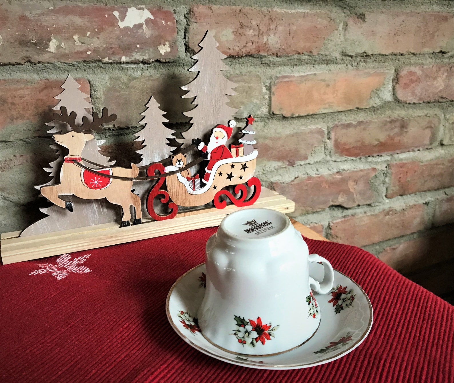 Christmas tea cup and saucer set with poinsettia design on the Etsy