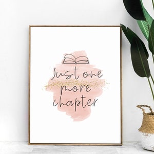 May include: A printable wall art design with a pink watercolor background and gold glitter. The design features a simple line drawing of an open book and the text "Just one more chapter".