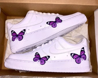 white nikes with butterflies