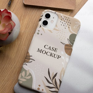May include: A phone case mockup with a beige background and a floral pattern in shades of brown, green, and white. The text "CASE MOCKUP" is printed in black on the case.